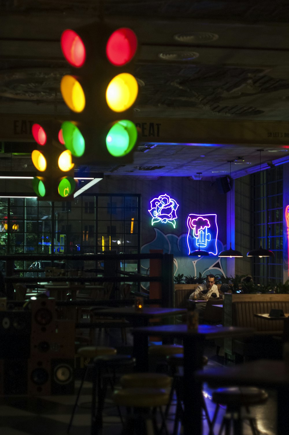 few people sitting near restaurant during night time