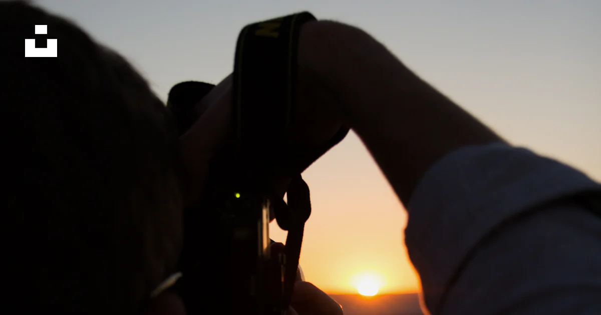 Person using camera capturing sunset photo – Free Romania Image on Unsplash