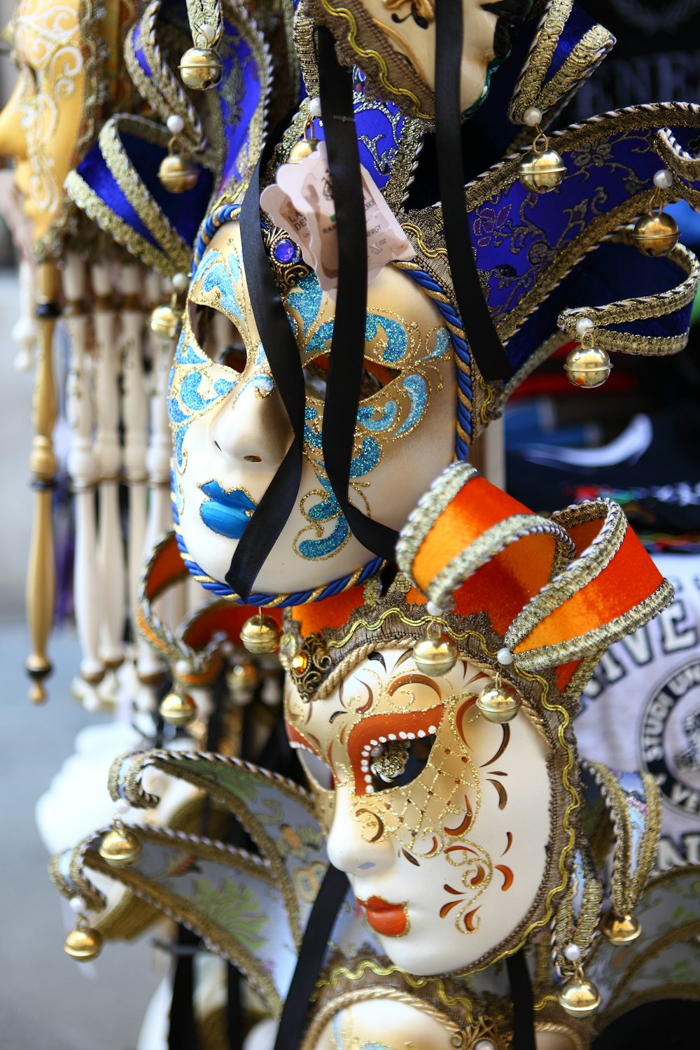 jester masquerade masks displayed along road