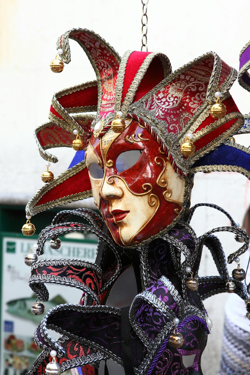 red and yellow jester mask