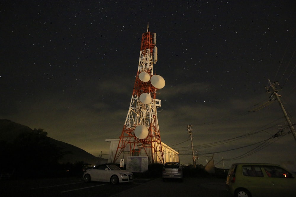 red and white tower during nighttime