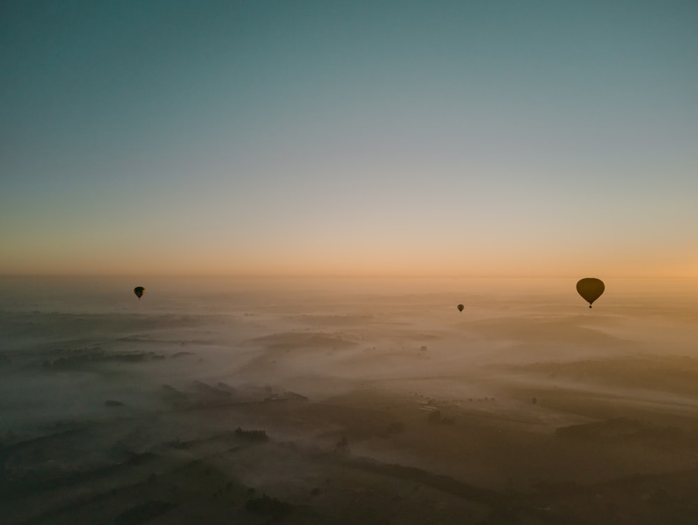hot air balloons on mid air under clear blue sky
