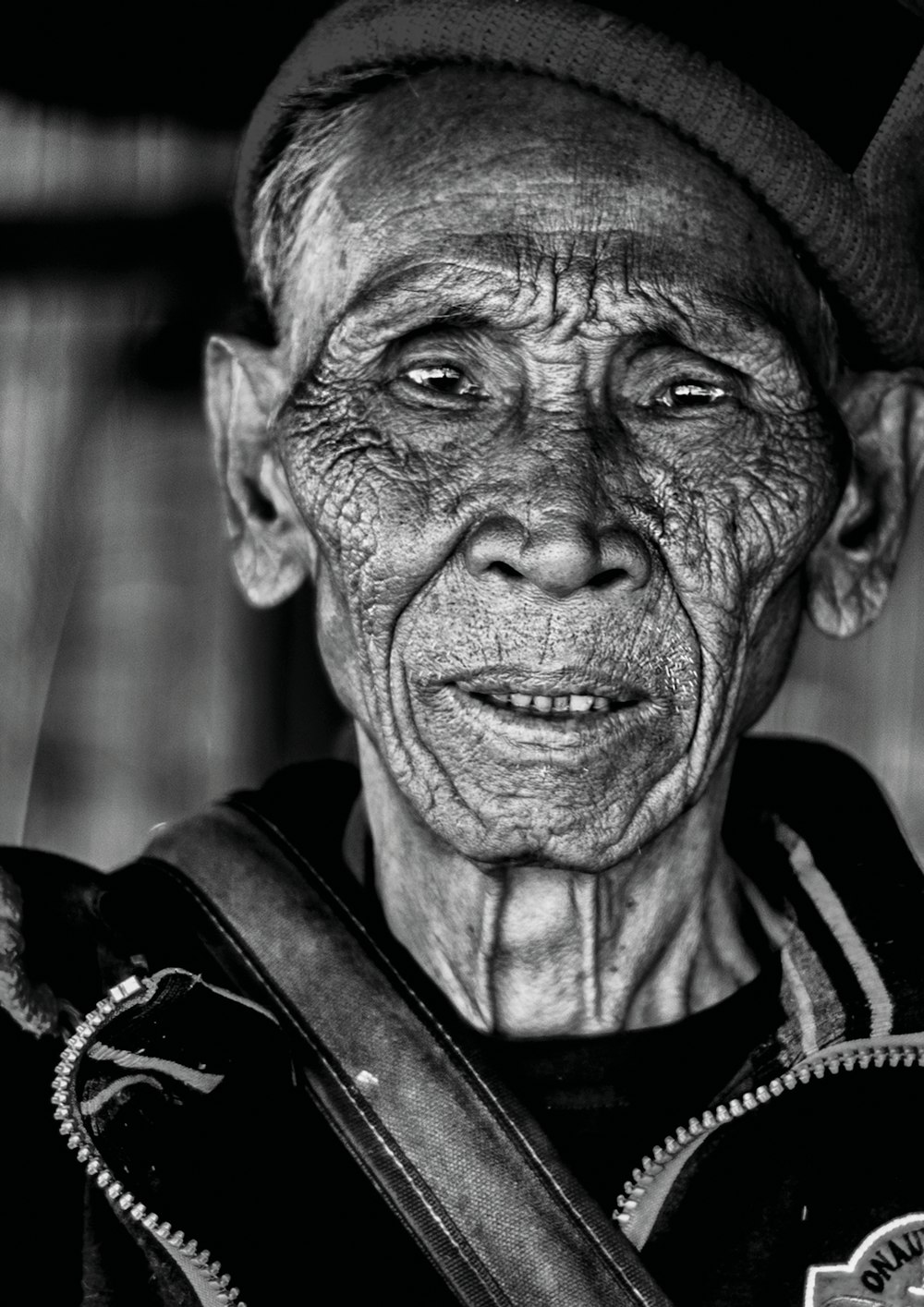 grayscale photography of man wearing jacket