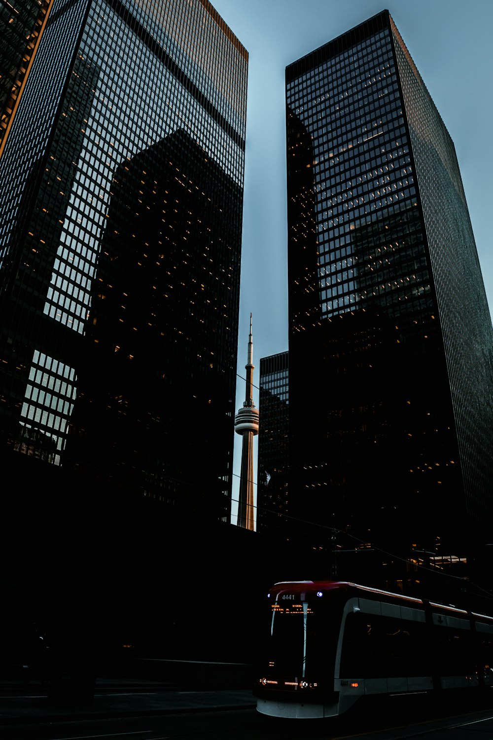 train passing two high-rise buildings