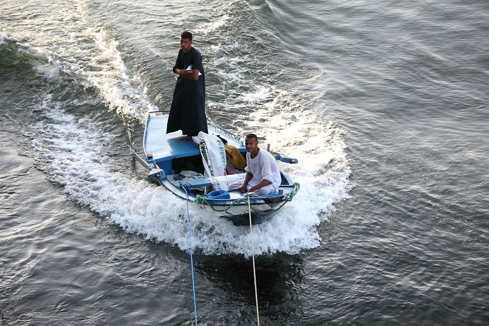 two person riding on motorboat at the sea