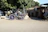 Elegant white Cinderella carriage adorned with soft blush pink flowers, glowing under warm sunset light.