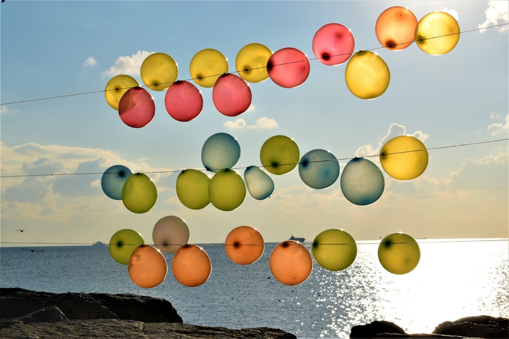 blue, yellow, and red balloons tied on string