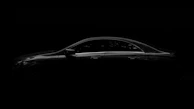 Profile shot of a luxury sedan with flawless paint and subtle reflections emphasizing form.