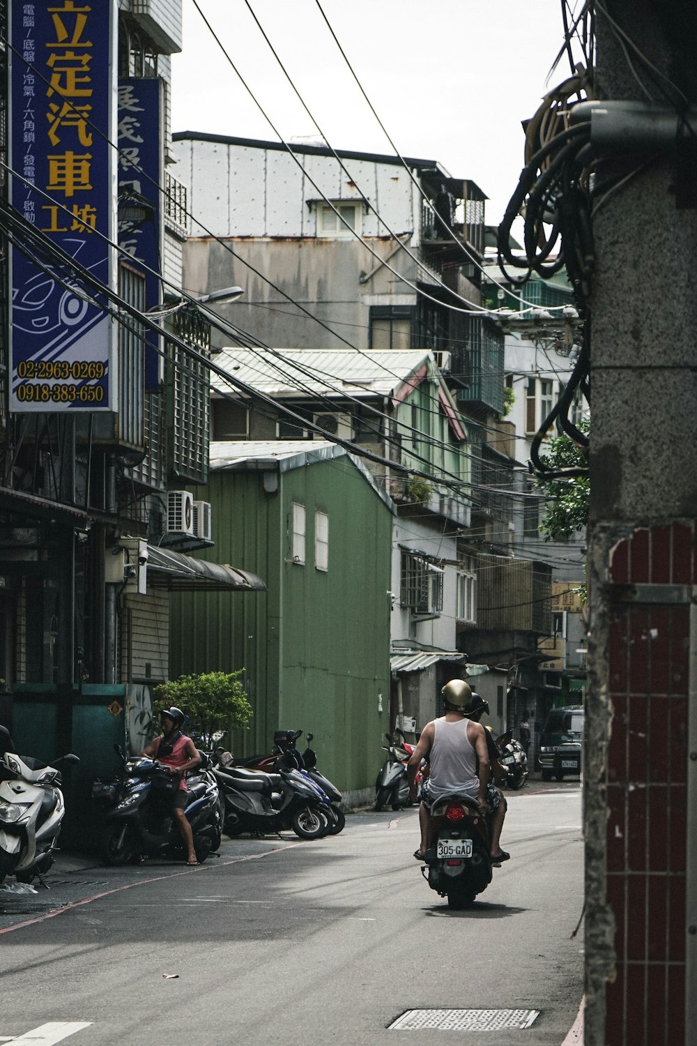 man riding motorcycle on road