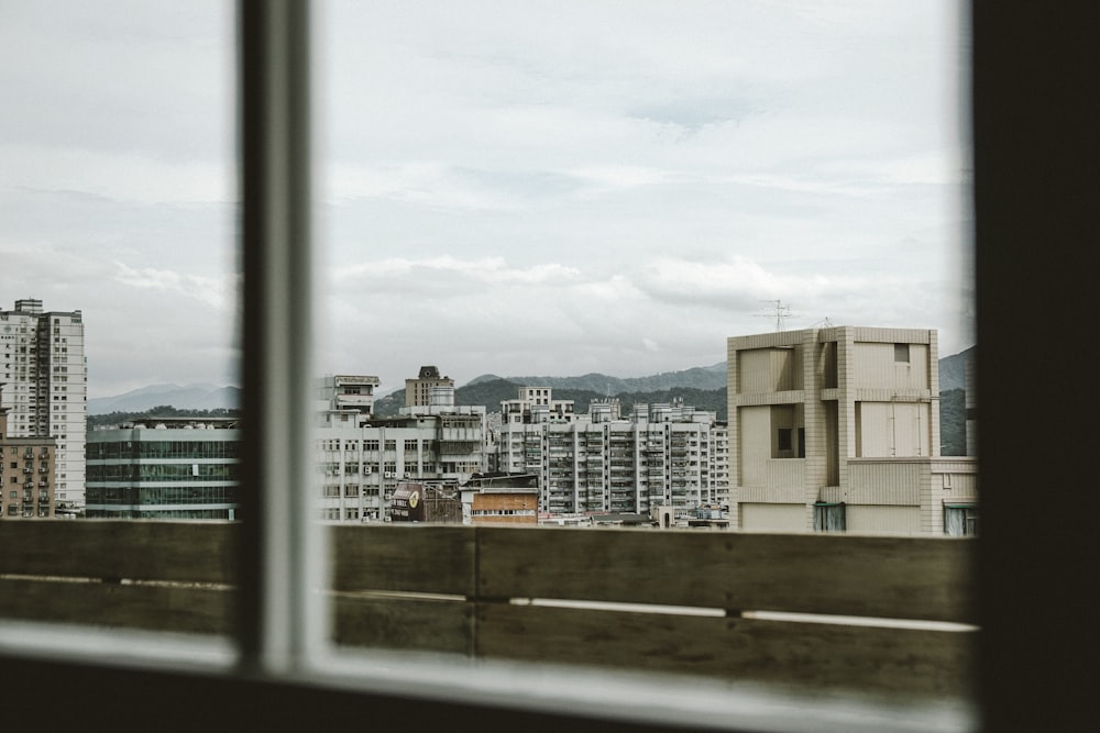 several building seen through glass window