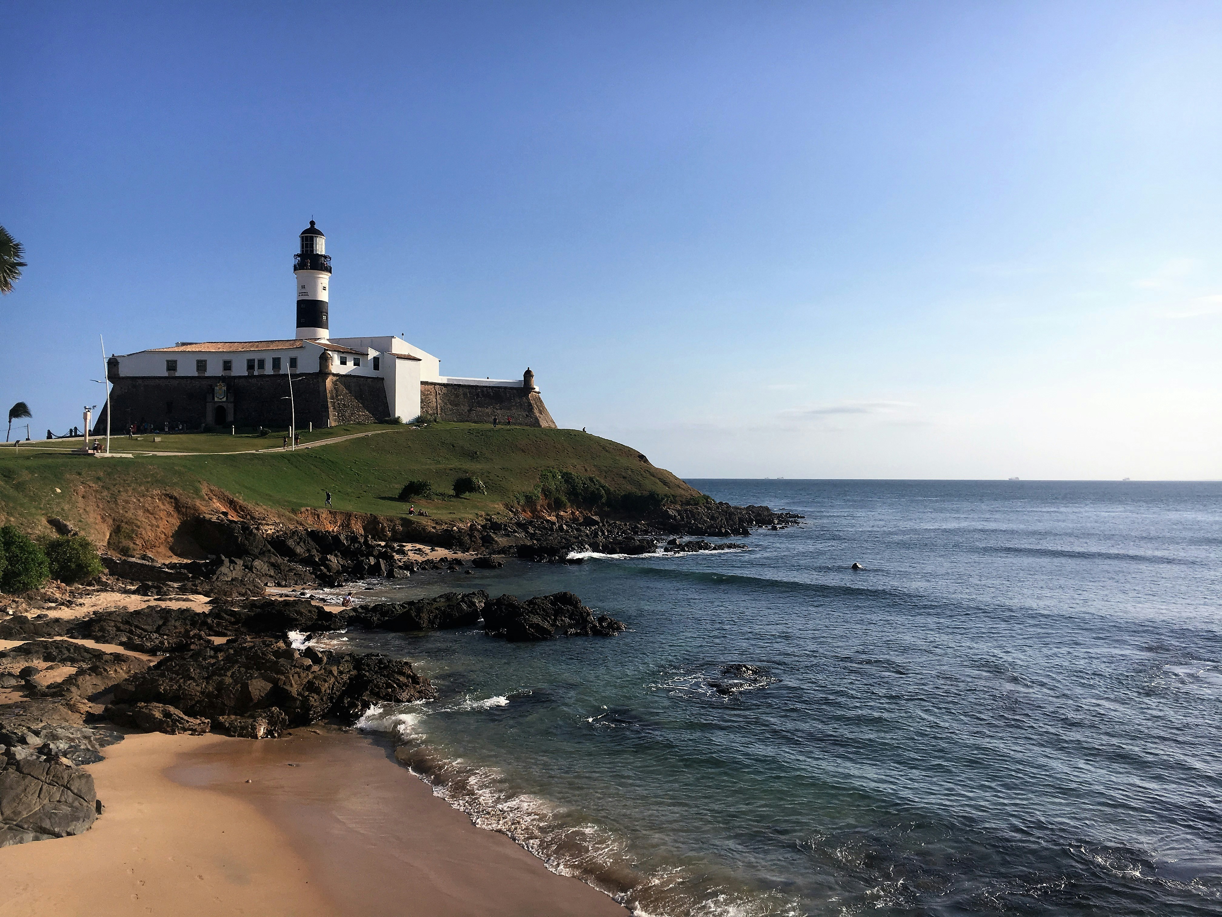 white lighthouse near sea