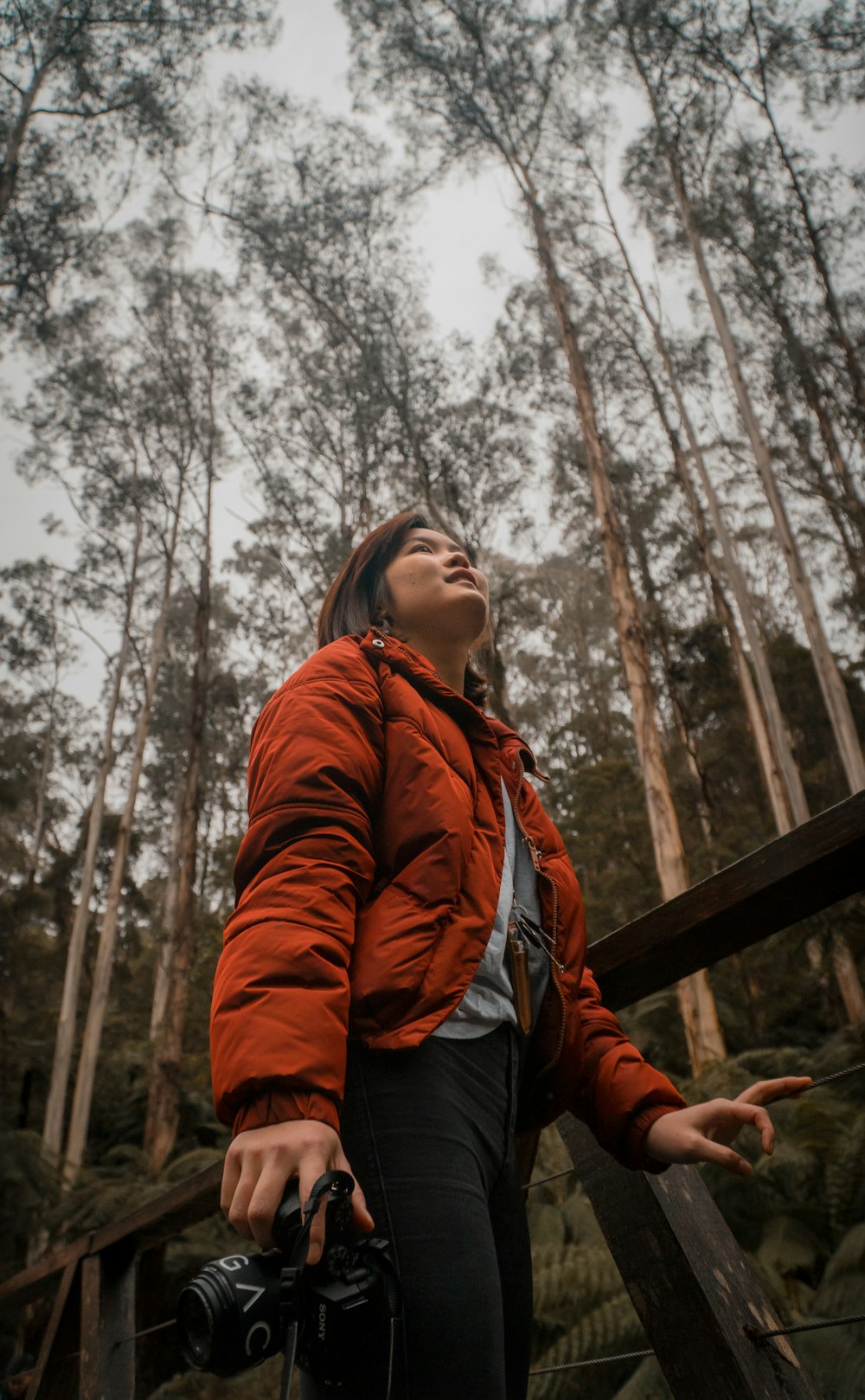 women's red jacket close-up photography