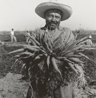 ,man holding rootcrop