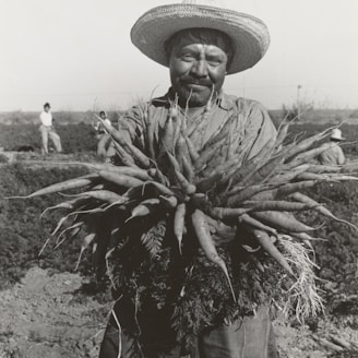 ,man holding rootcrop