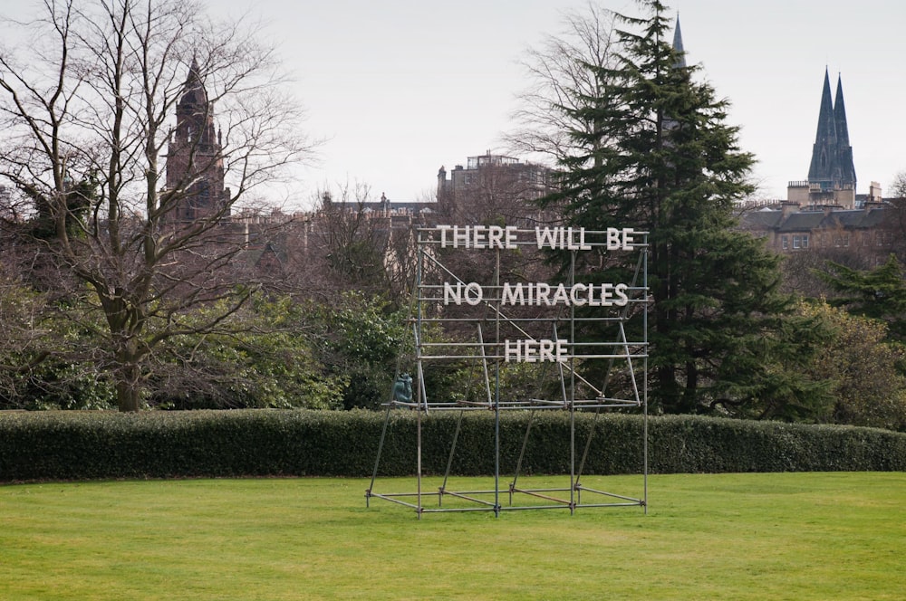 a sign that reads there will be no miracles here