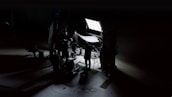 A haunting scene from a film set, featuring dim lighting and ominous shadows that enhance the horror atmosphere.