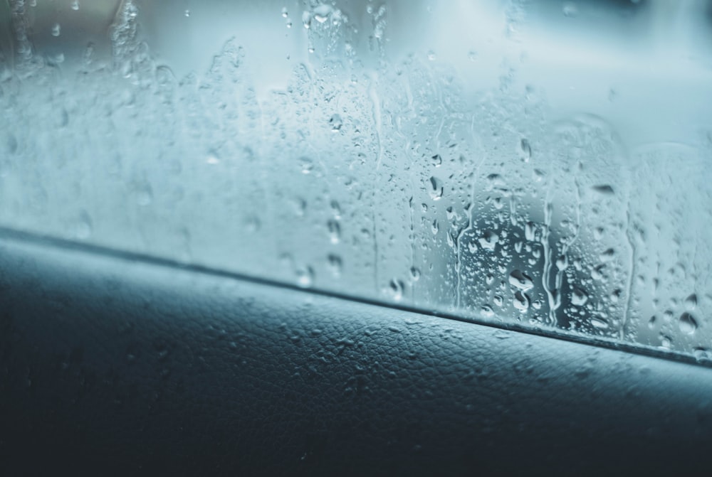 a close up of a rain covered window