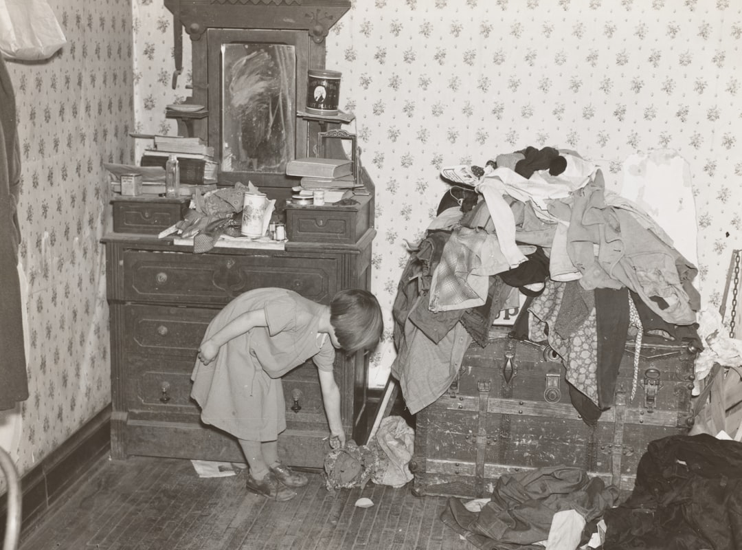 girl beside vanity dresser and clothes