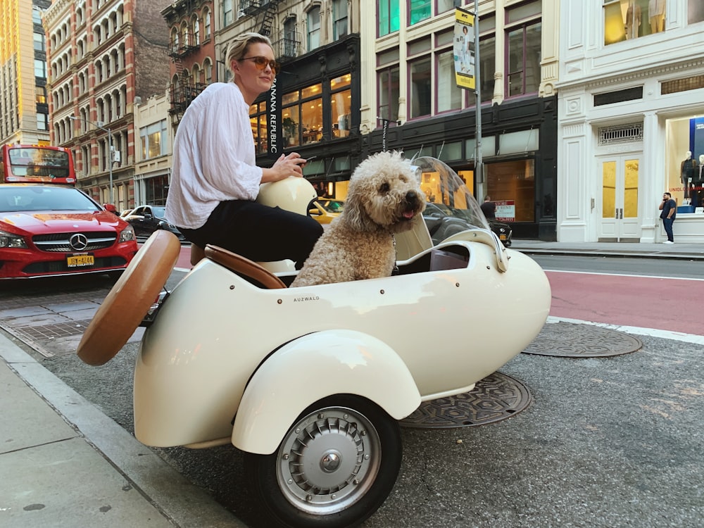 woman riding on vehicle