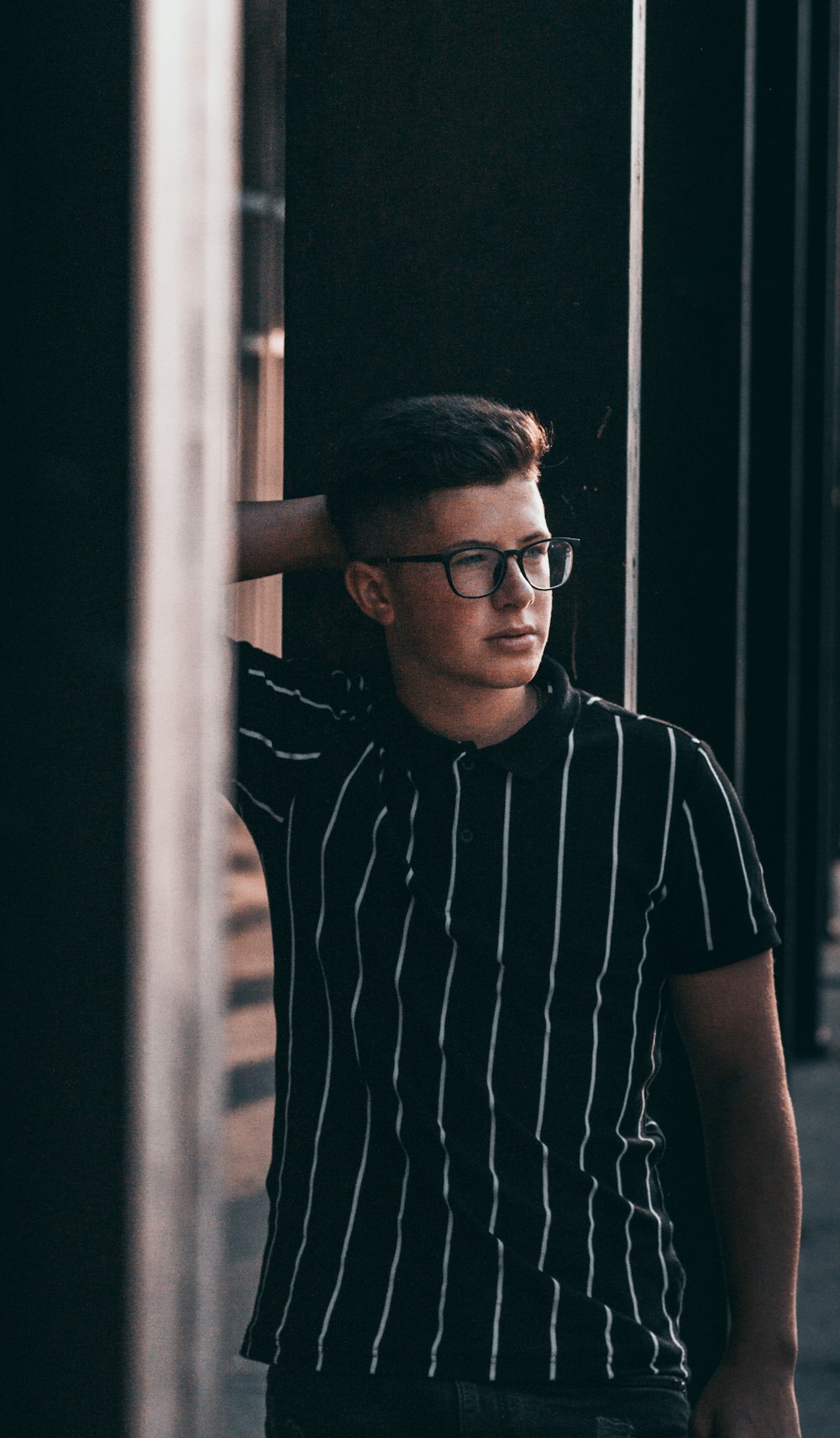 man in black and white striped t-shirt