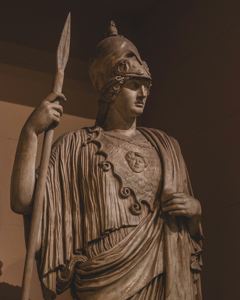man with spear and robe statue