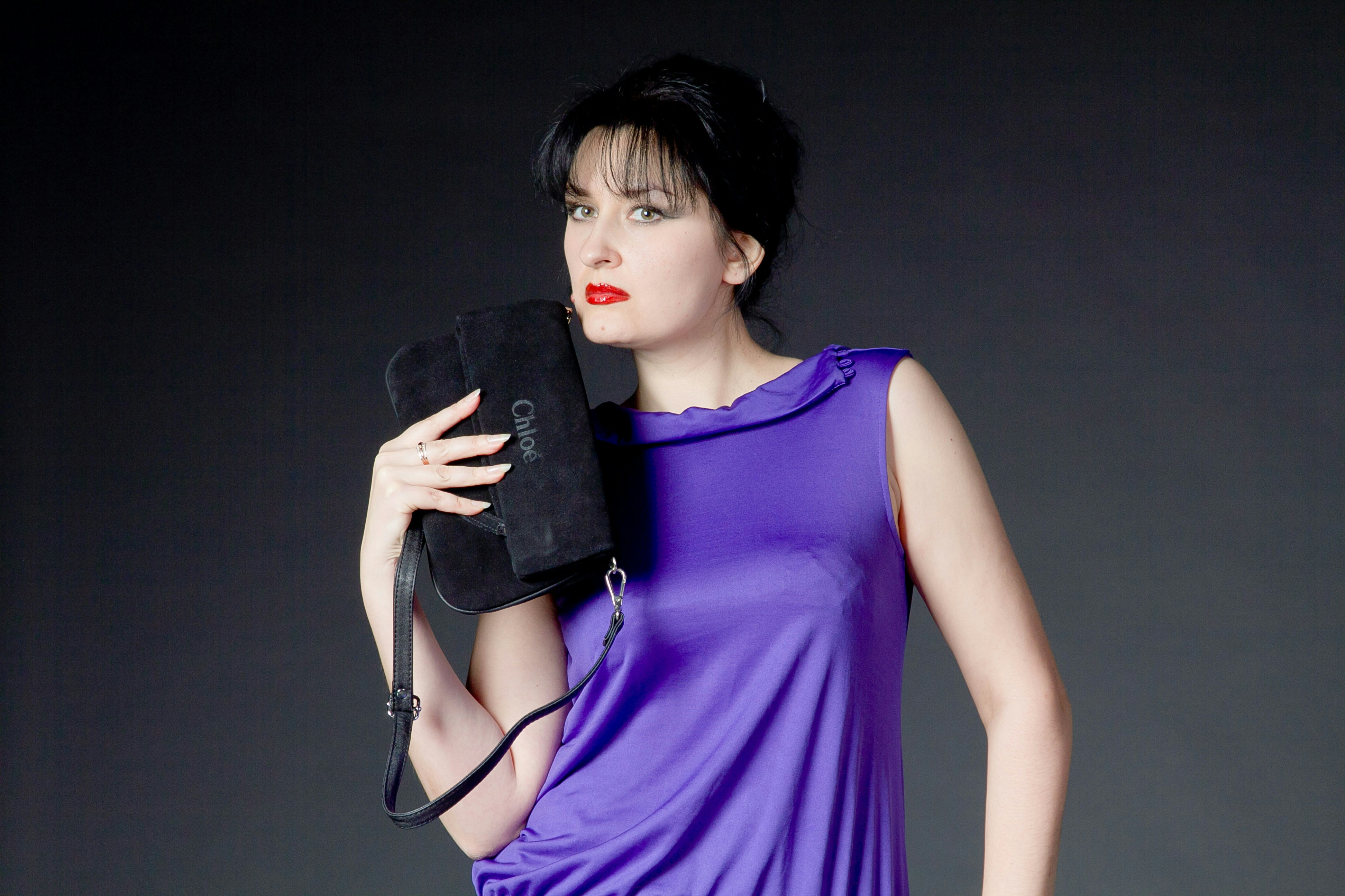 Female Model with Class and Distinction at a Photo-shoot, Colorful blue silk dress.
