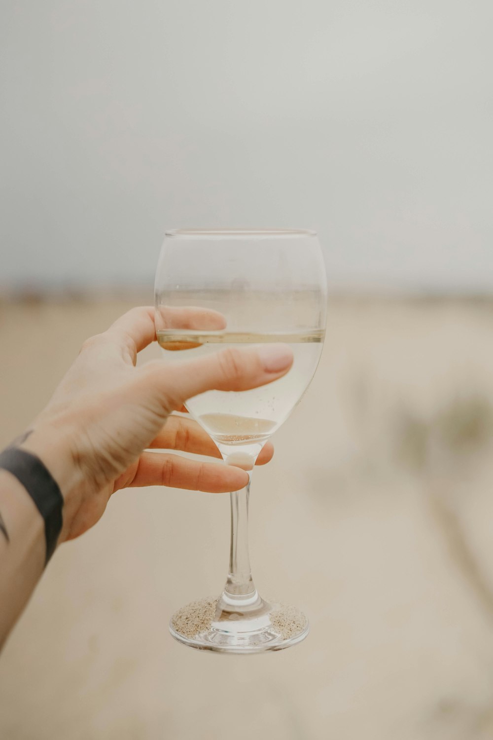 person holding glass of water