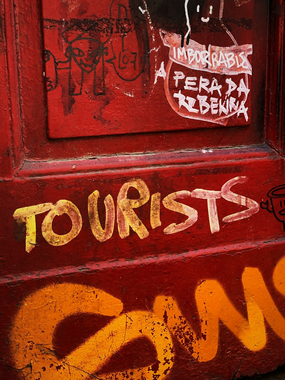 tourists text on red wood