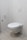 A modern, minimalistic bathroom featuring a wall-mounted toilet with a flush panel above it. The walls and floor are covered with light-colored tiles, and there is a toilet paper holder on the wall.