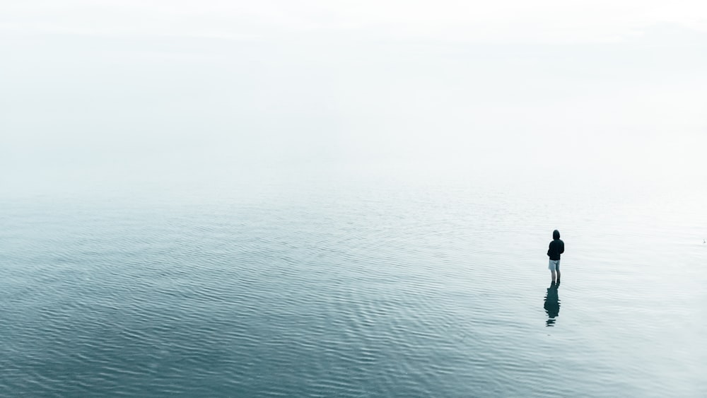 person standing on ocean