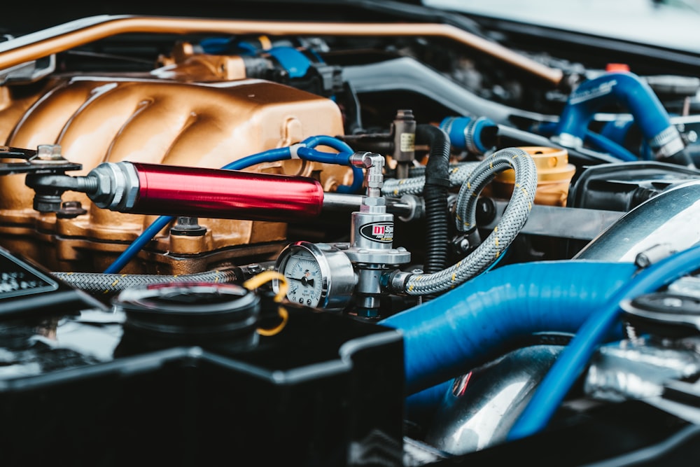 red, gray, blue, and brown car engine