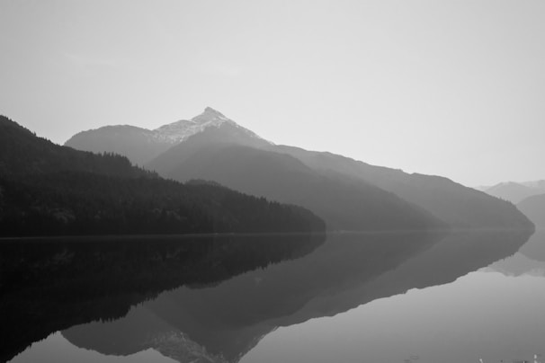 Snow-capped peaks of Himachal Pradesh reflected in a serene mountain lake