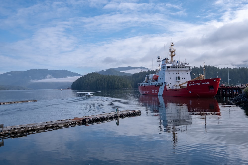 red and white ship near dock