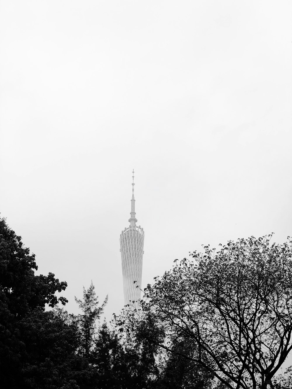 white tower in foggy day
