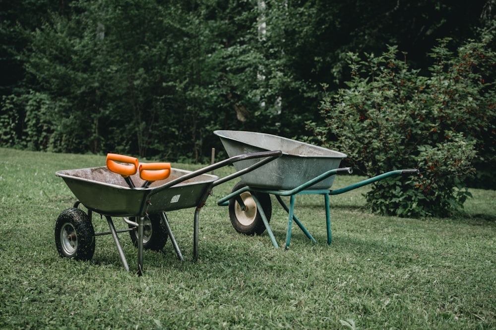 two grey wheelbarrows