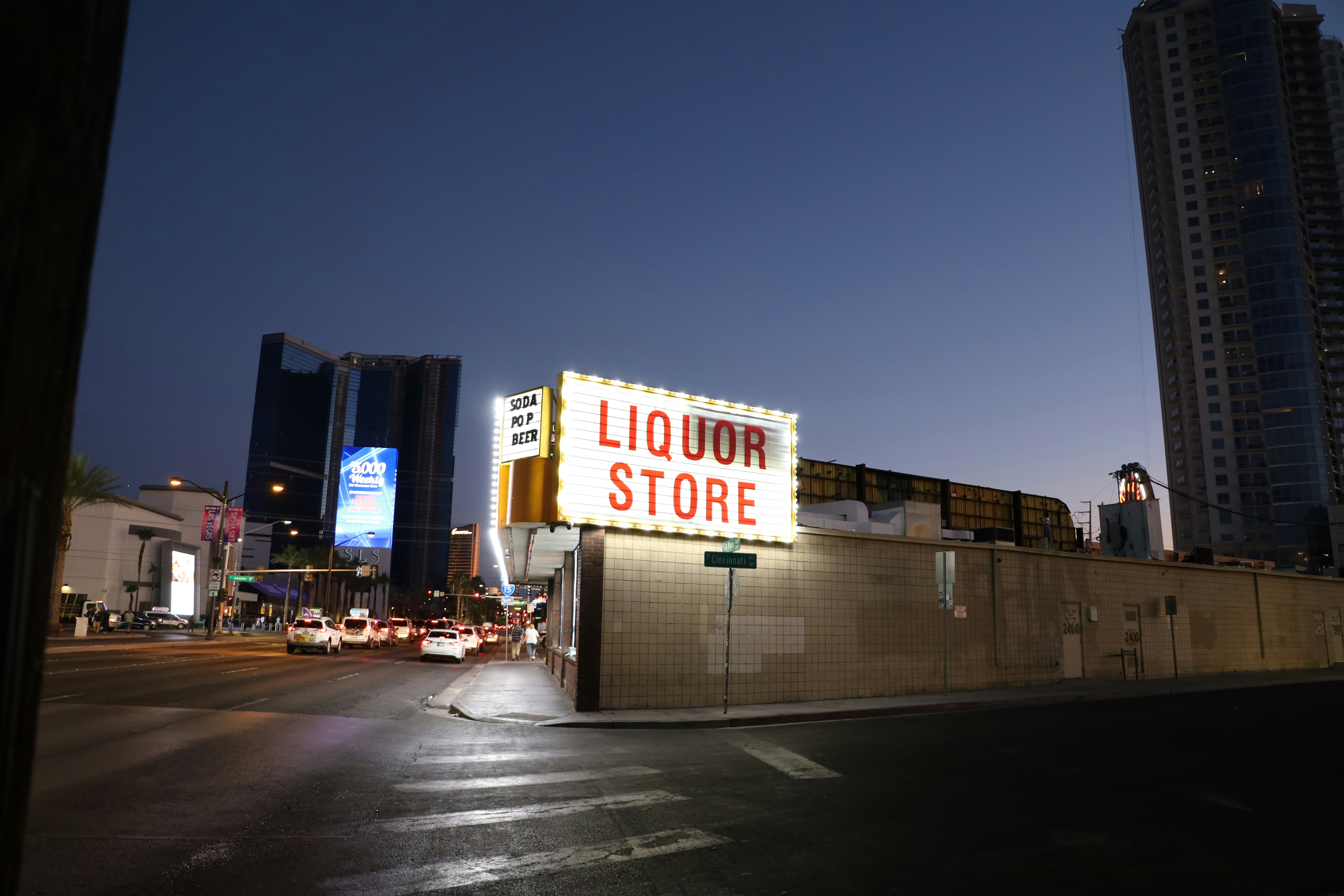 a liquor store sign on the side of a building