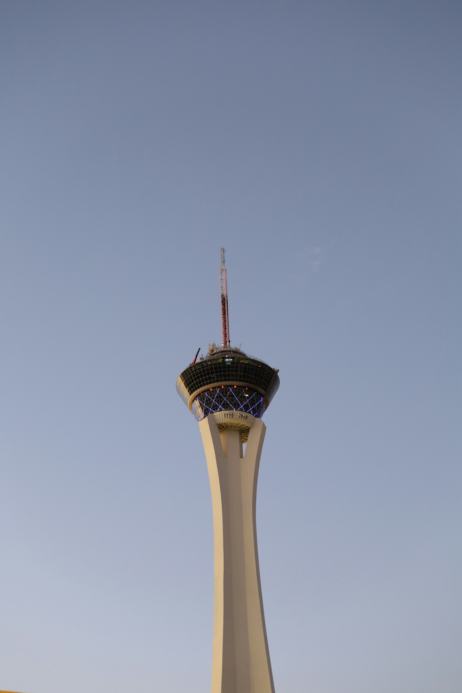 white concrete tower under blue sky