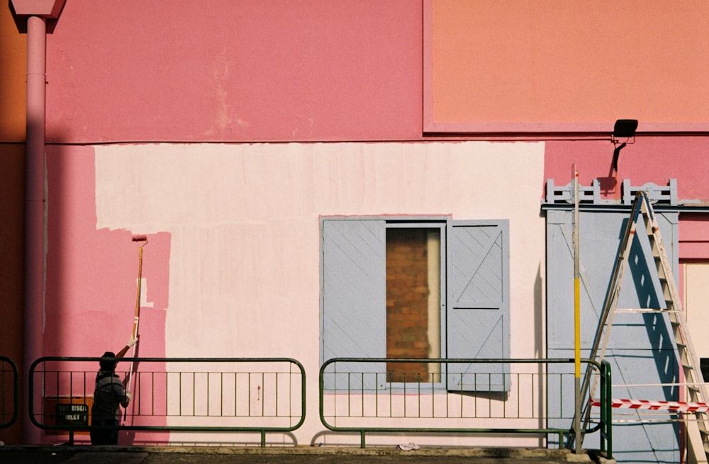 white, pink, and blue paint wall