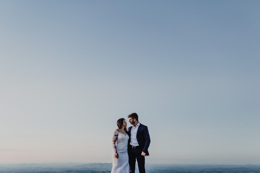 man and woman looking each other during daytime