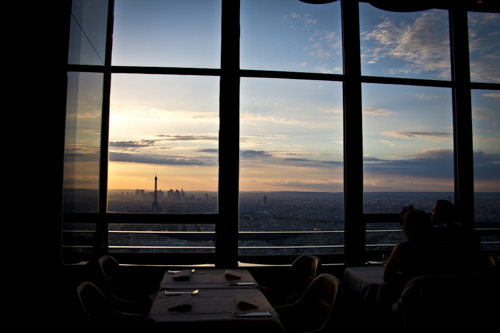 tables and chairs by glass walls