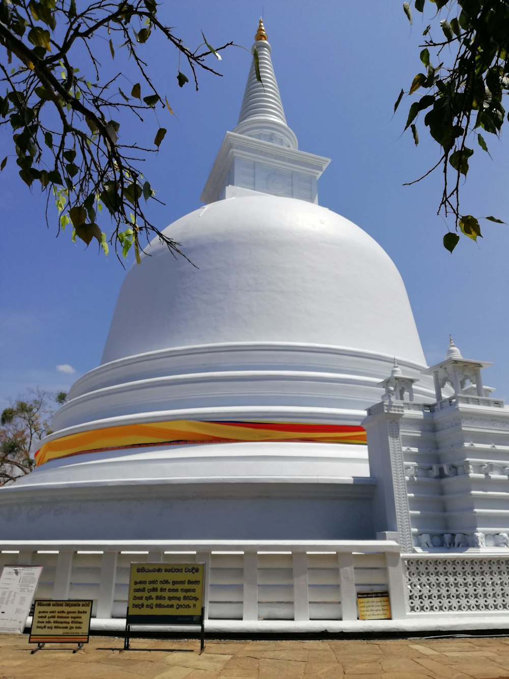 bell-shaped white building structure under blue sky