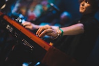 Keyboardist’s fingers dancing across vintage keys, adding rich layers to our classic R&B sound.