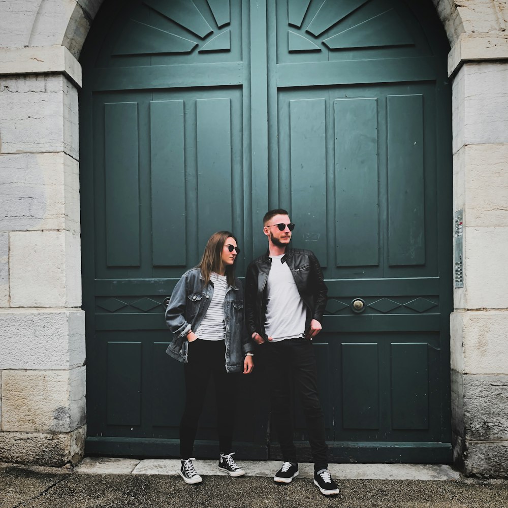 man and woman standing near closed door