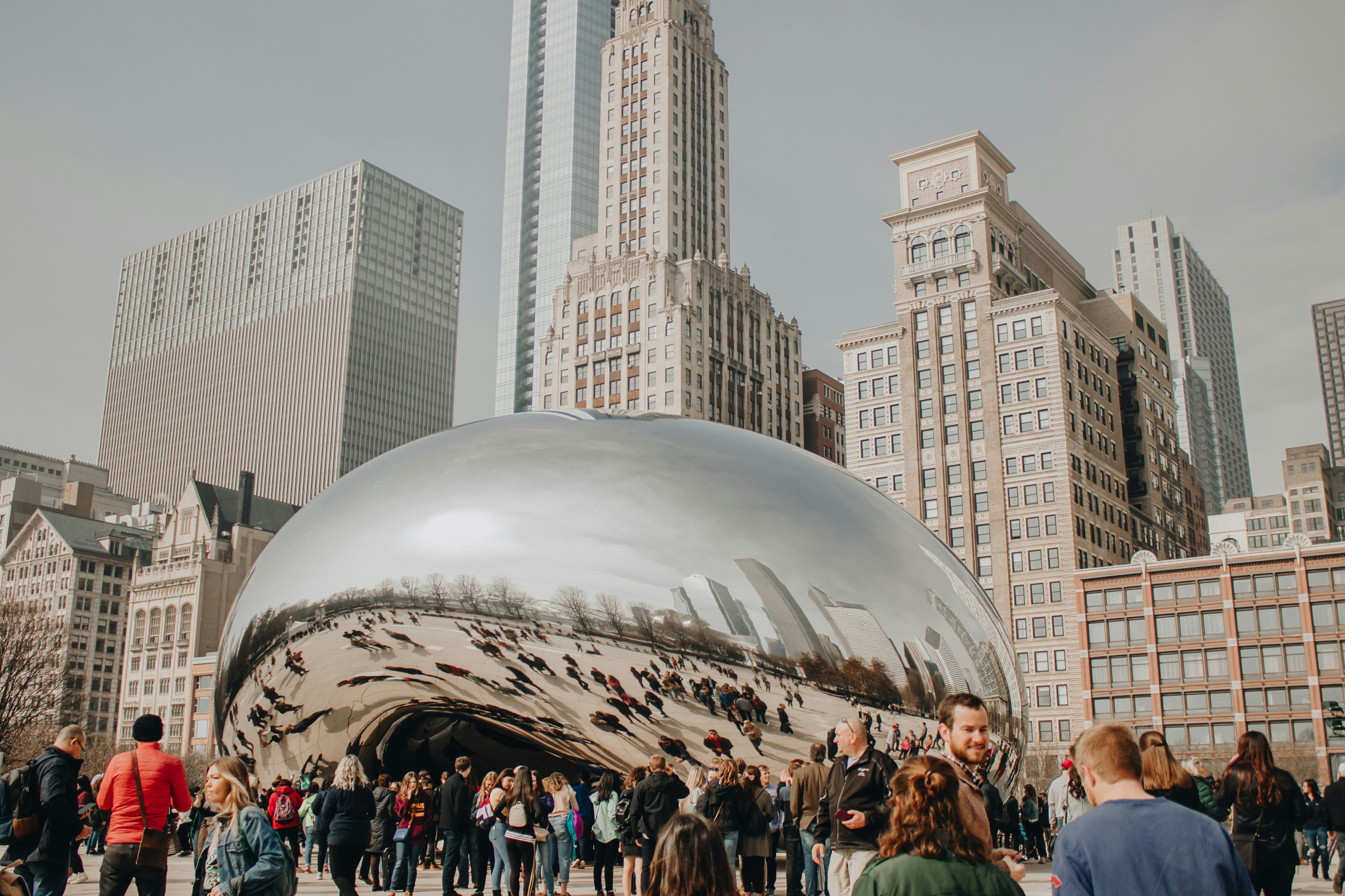 people standing near high buildings during daytime