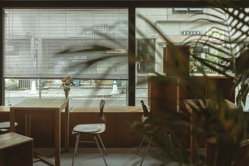 two empty chairs facing the tables