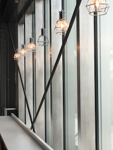 An industrial-style workspace featuring sleek metal hoods and warm ambient lighting.