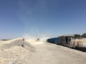 Close-up of a bulldozer operating on a dusty construction site in Saudi Arabia.