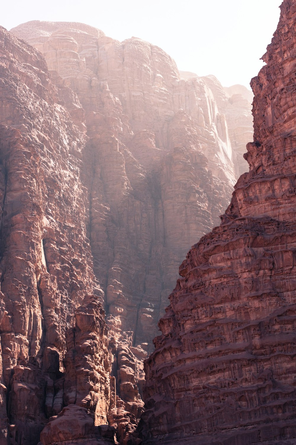 low-angle photography of brown rocky mountains