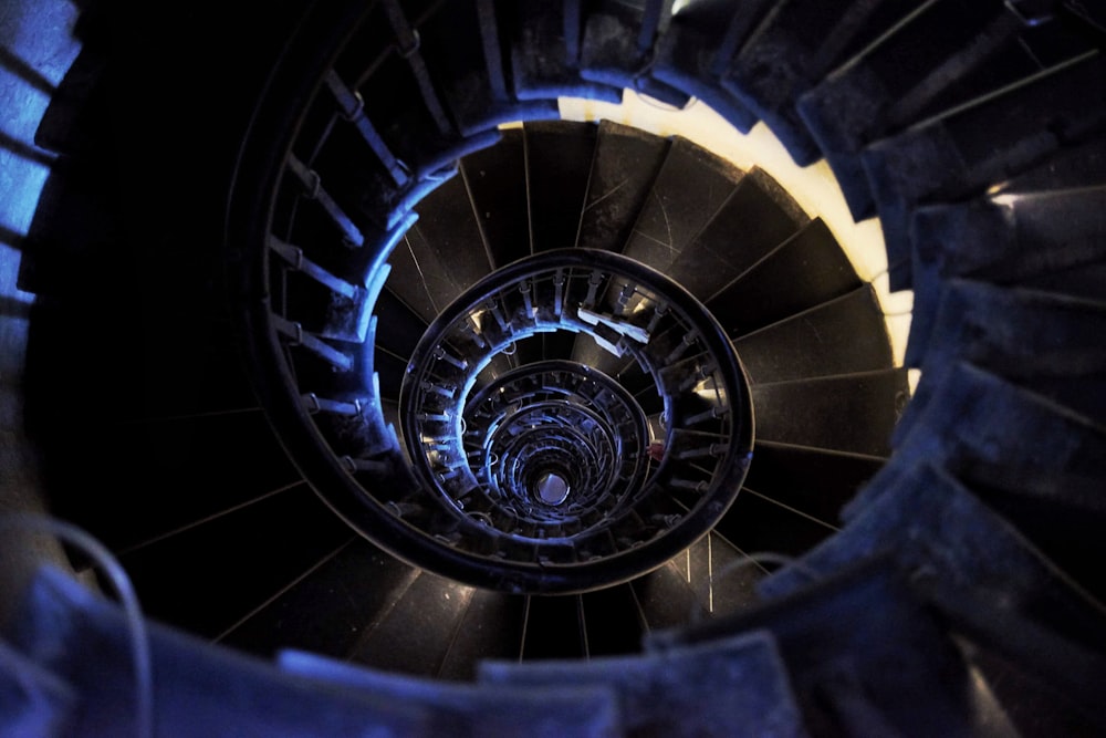 poorly lit spiral staircase