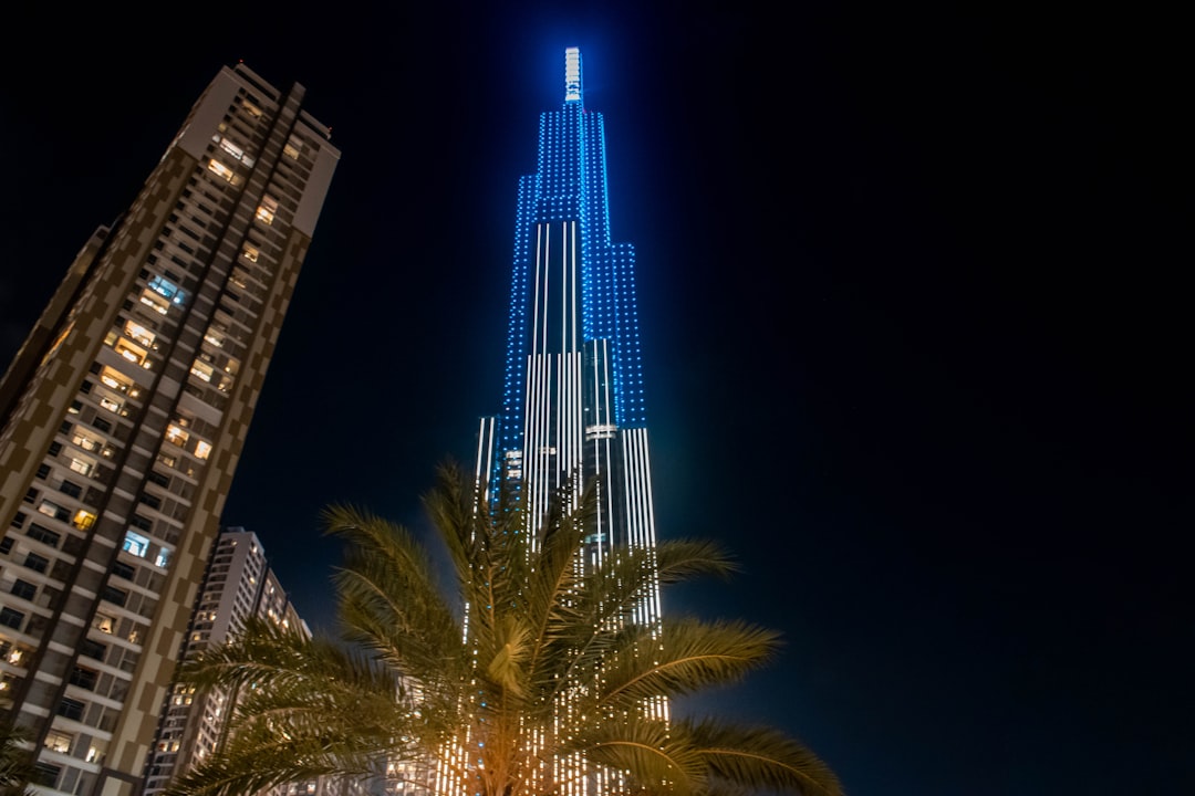 gray high-rise building, Blue Tower in a Dark Night.